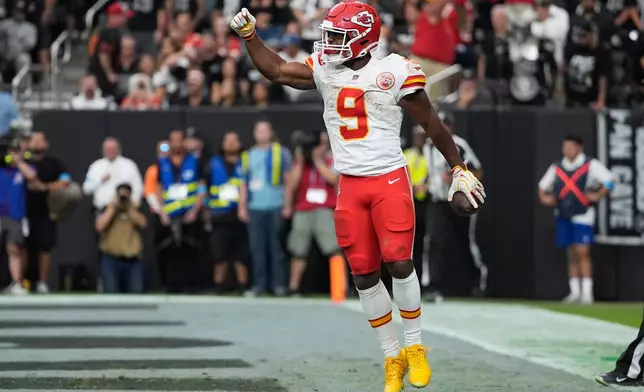 Kansas City Chiefs running back Kenneth Walker (9) celebrates after scoring a touchdown during the second half of an NFL football game against the Las Vegas Raiders in Las Vegas, Sunday, Oct. 4, 2026. (AP Photo/John Locher)