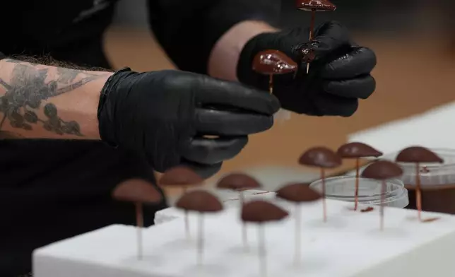 Representing the Nordic countries, Kasper Kleihs, competes during the World Chocolate Masters event in Antwerp, Belgium, Tuesday, Oct. 27, 2026. (AP Photo/Virginia Mayo)