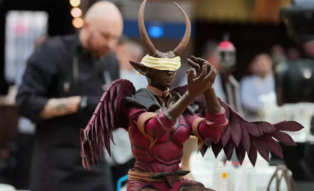 Kasper Kleihs, of Sweden, competes with his chocolate creation depicting an elf during the World Chocolate Masters event in Antwerp, Belgium, Monday, Oct. 26, 2026. (AP Photo/Virginia Mayo)
