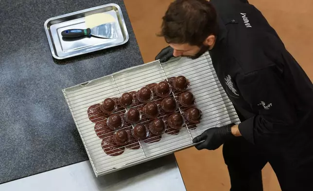 Italy's Tommaso Grollero competes during the World Chocolate Masters event in Antwerp, Belgium, Tuesday, Oct. 27, 2026. (AP Photo/Virginia Mayo)