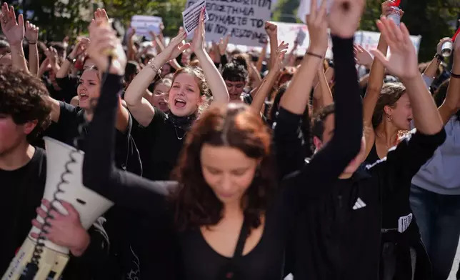 Protesters take part in a rally organized by teachers and students demanding improvements to education and measures to address the rising cost of living in Athens, Greece, Wednesday, Oct. 21, 2026. (AP Photo/Petros Giannakouris)
