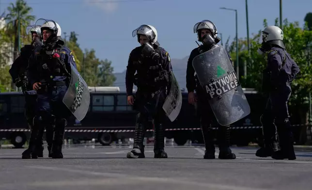 Greek police during a protest organized by teachers and students demanding improvements to education and measures to address the rising cost of living in Athens, Greece, Wednesday, Oct. 21, 2026. (AP Photo/Thanassis Stavrakis)