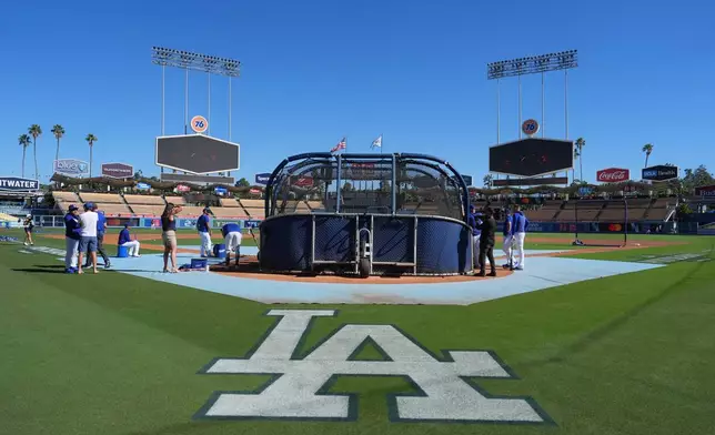Members of the Los Angeles Dodgers take part in batting practice before Game 1 of a National League Division Series baseball game against the Atlanta Braves Saturday, Oct. 3, 2026, in Los Angeles. (AP Photo/Jae C. Hong)