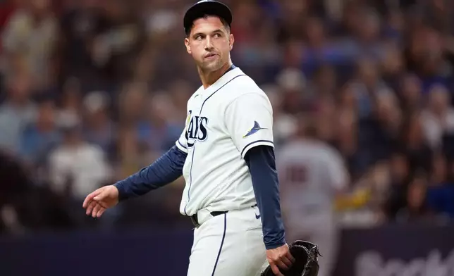 Tampa Bay Rays pitcher Ian Seymour reacts after giving up two runs against the Cleveland Guardians during the eighth inning in Game 1 of an American League Championship Series baseball game in St. Petersburg, Fla. Monday, Oct. 12, 2026. (AP Photo/David J. Phillip)