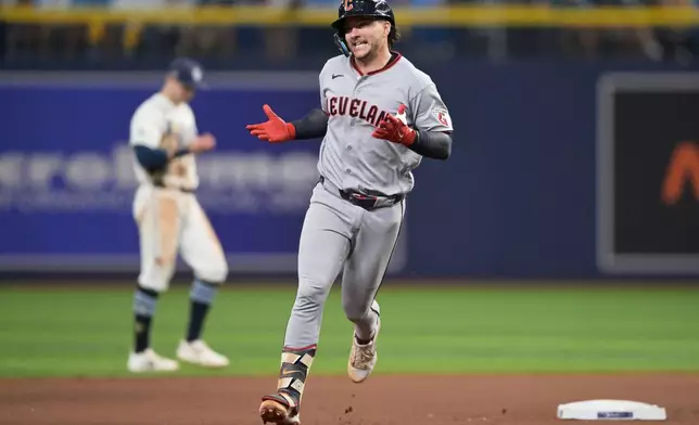 Cleveland Guardians' Patrick Bailey celebrates after a home run against the Tampa Bay Rays during the seventh inning in Game 1 of an American League Championship Series baseball game in St. Petersburg, Fla. Monday, Oct. 12, 2026. (AP Photo/Phelan M. Ebenhack)