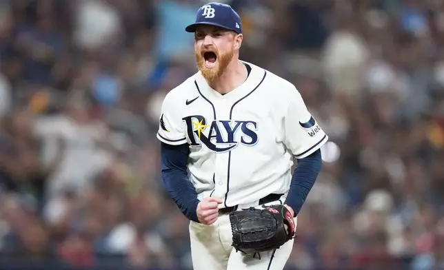 Tampa Bay Rays pitcher Drew Rasmussen celebrates after striking out Cleveland Guardians' José Ramírez during the fifth inning in Game 1 of an American League Championship Series baseball game in St. Petersburg, Fla. Monday, Oct. 12, 2026. (AP Photo/David J. Phillip)