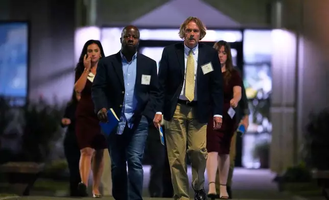 Media witnesses leave Riverbend Maximum Security Institution after the execution of Christa Pike was halted Wednesday, Sept. 30, 2026, in Nashville, Tenn. (AP Photo/George Walker IV)
