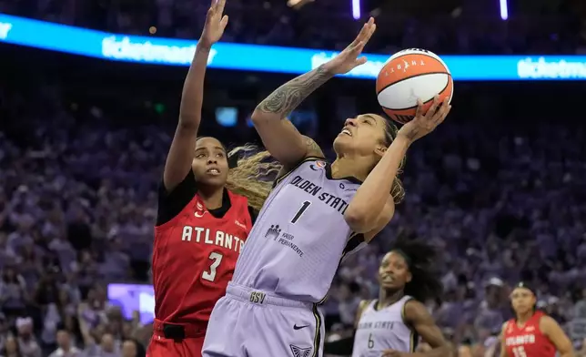 Golden State Valkyries forward Gabby Williams (1) shoots against Atlanta Dream guard Jordin Canada (3) during the first half of Game 1 of the WNBA basketball finals, Saturday, Oct. 17, 2026, in San Francisco. (AP Photo/Jeff Chiu)