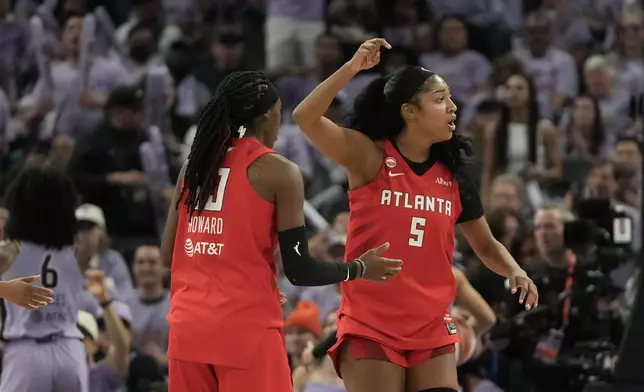 Atlanta Dream forward Angel Reese (5) and guard Rhyne Howard react toward officials during the first half of Game 1 of the WNBA basketball finals against the Golden State Valkyries, Saturday, Oct. 17, 2026, in San Francisco. (AP Photo/Jeff Chiu)