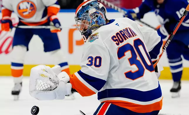 New York Islanders goaltender Ilya Sorokin (30) makes a save against the Toronto Maple Leafs during the second period of an NHL hockey game in Toronto, Saturday, Oct. 17, 2026. (Frank Gunn/The Canadian Press via AP)