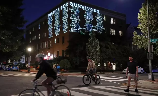 A message is projected on the side of a Cornell University building, Wednesday, Oct. 7, 2026, in Washington. (AP Photo/Rahmat Gul)