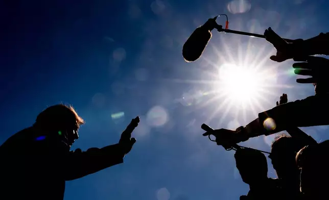 President Donald Trump speaks with reporters before boarding Marine One on the South Lawn of the White House, Wednesday, Oct. 7, 2026, in Washington. (AP Photo/Julia Demaree Nikhinson)