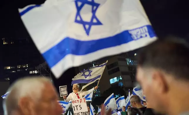 A demonstrator wearing a mask depicting Israeli Prime Minister Benjamin Netanyahu attends an anti-government protest ahead of Israel's general election, Saturday, Oct. 24, 2026, in Tel Aviv, Israel. (AP Photo/David Goldman)