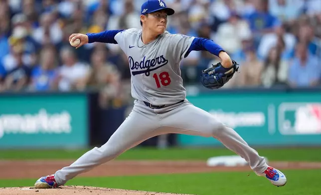 Los Angeles Dodgers pitcher Yoshinobu Yamamoto throws during the first inning of Game 2 of baseball's National League Championship Series between the Milwaukee Brewers and the Los Angeles Dodgers, Monday, Oct. 12, 2026, in Milwaukee. (AP Photo/Abbie Parr)