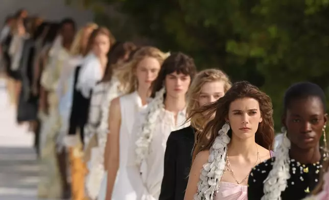 Models wear creations as part of the Christian Dior Womenswear Spring Summer 2027 collection presented in Paris, France, Tuesday, Sept. 29, 2026. (AP Photo/Thomas Padilla)