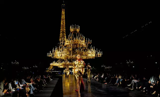 A model wears a creation as part of the Saint Laurent Womenswear Spring Summer 2027 collection presented in Paris, France, Tuesday, Sept. 29, 2026. (AP Photo/Teresa Suarez)