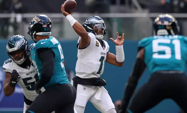 Philadelphia Eagles quarterback Jalen Hurts (1) passes the ball during an NFL football game against Jacksonville Jaguars in London, Sunday, Oct. 11, 2026. (AP Photo/Ian Walton)