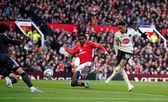 Bournemouth's Marcus Tavernier, right, shoots to score his side's second goal during the English Premier League soccer match between Manchester United and Bournemouth in Manchester, England, Sunday, Oct. 25, 2026. (AP Photo/Dave Thompson)