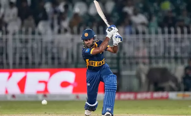 Sri Lanka's Pavan Rathnayake plays a shot during the tri-series one-day international cricket match between Pakistan and Sri Lanka, in Rawalpindi, Pakistan, Sunday, Oct. 18, 2026. (AP Photo/Anjum Naveed)