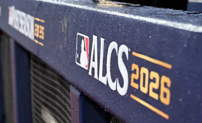Rain drips from the field before Game 4 of an American League Championship Series baseball game between the Cleveland Guardians and the Tampa Bay Rays in Cleveland, Friday, Oct. 16, 2026.(AP Photo/Phil Long)