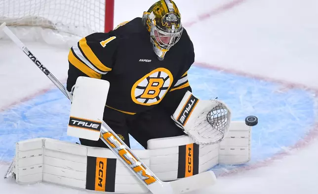 Boston Bruins goaltender Jeremy Swayman catches the puck on a shot by the Philadelphia Flyers in the first period of an NHL hockey game Saturday, Oct. 10, 2026, in Boston. (AP Photo/Steven Senne)