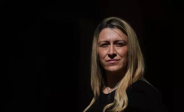 Florencia Navarro, who has accused priest Alejandro Nicola of sexually abusing her daughter, poses for a photo at her home in Carlos Paz, Cordoba, Argentina, Tuesday, Sept. 8, 2026. (AP Photo/Natacha Pisarenko)