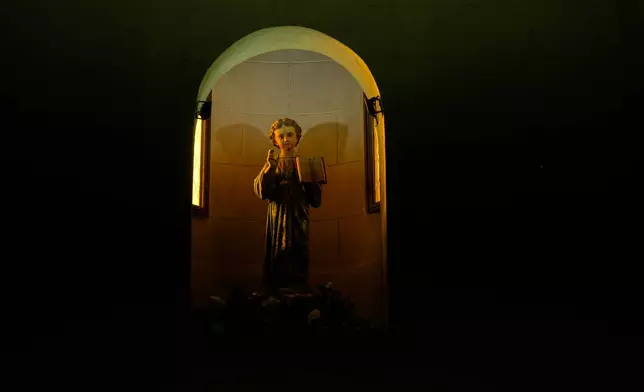 A statue of the Christ Child stands inside the Parroquia del Niño Dios or Parish of the Child Jesus, where priest Alejandro Nicola was removed from his parish duties amid criminal allegations of sexual abuse involving young children at an affiliated kindergarten, in Villa Carlos Paz, Argentina, Tuesday, Sept. 8, 2026. (AP Photo/Natacha Pisarenko)