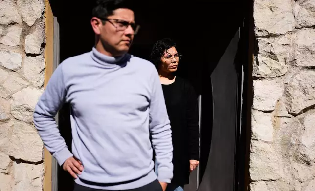 Fernanda Aguero and her husband Gustavo Oviedo, who have accused Catholic priest Alejandro Nicola of sexually abusing their daughter, stand outside their home in Carlos Paz, Cordoba, Argentina, Tuesday, Sept. 8, 2026. (AP Photo/Natacha Pisarenko)