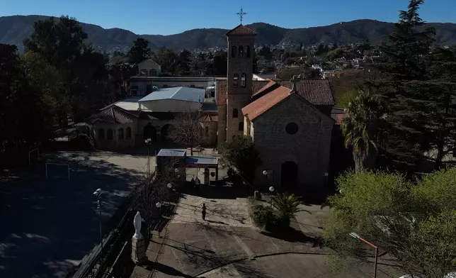 An aerial view of the Margarita A. de Paz Parish Center for Education and Culture and Parish of the Child Jesus, where priest Alejandro Nicola was released from his parish while criminal allegations involving sexual abuse of young children at the parish kindergarten, in Carlos Paz, Argentina, Tuesday, Sept. 8, 2026. (AP Photo/Natacha Pisarenko)