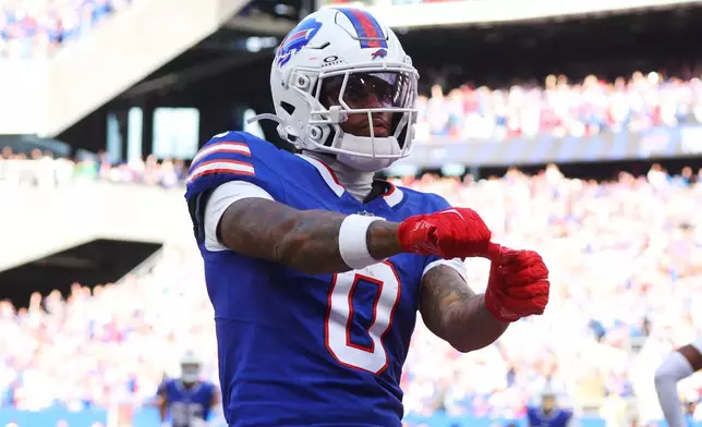 Buffalo Bills wide receiver Keon Coleman (0) celebrates after scoring a touchdown against the New England Patriots in the second half during an NFL football game in Orchard Park, N.Y., Sunday, Oct. 4, 2026. (AP Photo/Jeffrey T. Barnes)