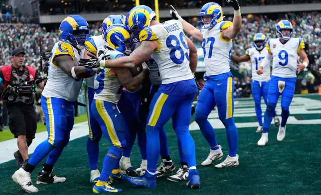Los Angeles Rams running back Kyren Williams (23) celebrates his touchdown with teammates during the second half of an NFL football game against the Philadelphia Eagles in Philadelphia, Sunday, Oct. 4, 2026. (AP Photo/Chris Szagola)