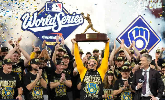 Milwaukee Brewers catcher William Contreras holds the MVP trophy after they won baseball's World Series against the Tampa Bay Rays, Wednesday, Oct. 28, 2026, in St. Petersburg, Fla. (AP Photo/Ashley Landis)