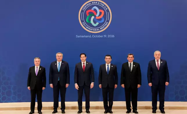US Secretary of State Marco Rubio poses for a C5+1 Ministerial family photo with Uzbekistan's Foreign Minister Bakhtiyor Saidov, Kazakhstan's Foreign Minister Mukhtar Tileuberdi, Tajikistan's Foreign Minister Sirojiddin Muhriddin, Turkmenistan's Foreign Minister Rashid Meredov, and Kyrgyzstan's Foreign Minister Jeenbek Kulubayev at the Congress Center in Samarkand, Uzbekistan, Monday, Oct. 19, 2026. (Kylie Cooper/Pool Photo via AP)