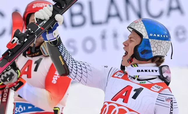 Brazil's Lucas Pinheiro Braathen celebrates winning an alpine ski, men's World Cup giant slalom, in Soelden, Austria, Sunday, Oct. 25, 2026. (AP Photo/Marco Trovati)