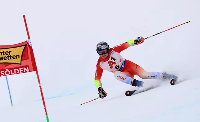 Switzerland's Marco Odermatt competes in an alpine ski, men's World Cup giant slalom, in Soelden, Austria, Sunday, Oct. 25, 2026. (AP Photo/Marco Trovati)