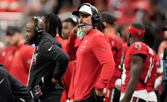 Atlanta Falcons head coach Kevin Stefanski watches from the sideline during the first half of an NFL football game against the Baltimore Ravens, Sunday, Oct. 11, 2026, in Atlanta. (AP Photo/Mike Stewart)