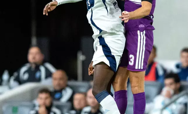 Vancouver Whitecaps forward Yadaly Diaby, left, and Austin FC defender Mikkel Desler (3) look to take possession of the ball during the second half of an MLS soccer match in Austin, Texas, Saturday, Oct. 17, 2026. (AP Photo/Stephen Spillman)
