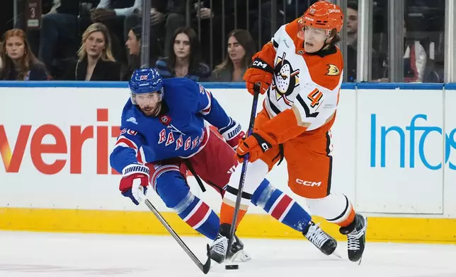 New York Rangers' Marcus Pettersson (26) defends Anaheim Ducks' Nikita Klepov (40) during the first period of an NHL hockey game Monday, Oct. 19, 2026, in New York. (AP Photo/Frank Franklin II)