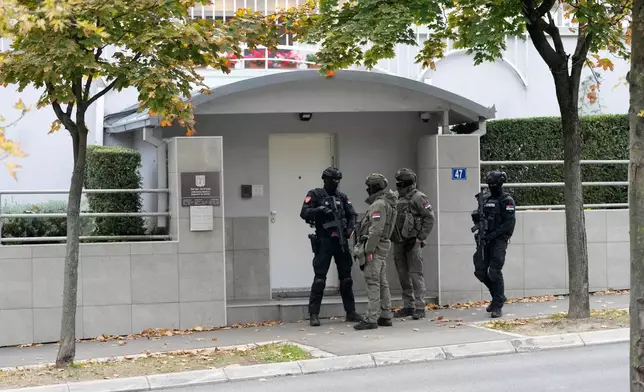 Serbian gendarmes guard the Israeli Embassy after an unidentified assailant attacked a guard with knives in Belgrade, Serbia, Wednesday, Oct. 28, 2026. (AP Photo/Darko Vojinovic)