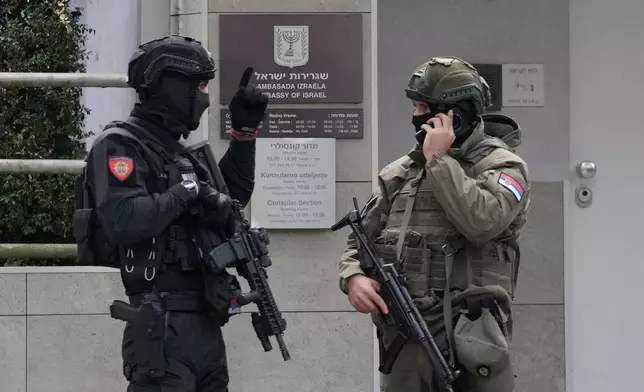 Serbian gendarmes guard the Israeli Embassy after an unidentified assailant attacked a guard with knives in Belgrade, Serbia, Wednesday, Oct. 28, 2026. (AP Photo/Darko Vojinovic)