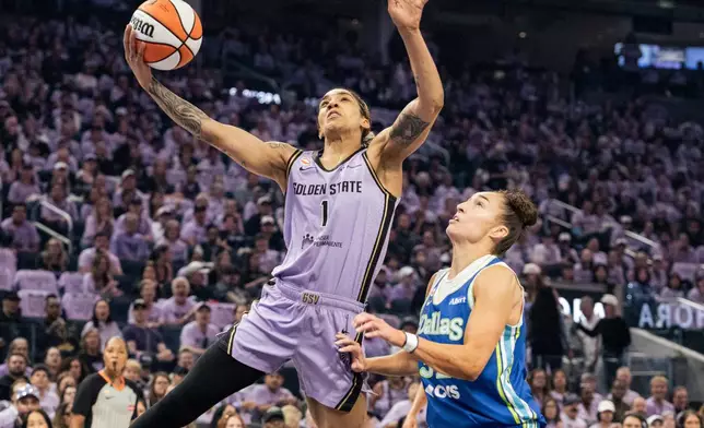 Golden State Valkyries forward Gabby Williams (1) drives for a layup against the Dallas Wings during the first quarter of Game 3 of a WNBA basketball first-round playoff series Friday, Oct. 2, 2026, in San Francisco. (Stephen Lam/San Francisco Chronicle via AP)