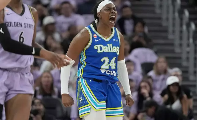 Dallas Wings guard Arike Ogunbowale (24) celebrates after scoring against the Golden State Valkyries during the first half of Game 3 of a WNBA basketball first-round playoff series, Friday, Oct. 2, 2026, in San Francisco. (AP Photo/Jeff Chiu)