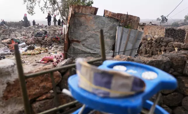 Men inspect the aftermath of a Jordanian airstrike in Al-Tuff, in the countryside of Daraa province in southern Syria, Tuesday, Oct. 27, 2026. (AP Photo/Ghaith Alsayed)