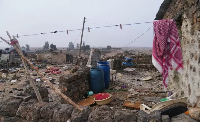 Household belongings lie scattered amid rubble after a Jordanian airstrike in Al-Tuff, in the countryside of Daraa province in southern Syria, Tuesday, Oct. 27, 2026. (AP Photo/Ghaith Alsayed)