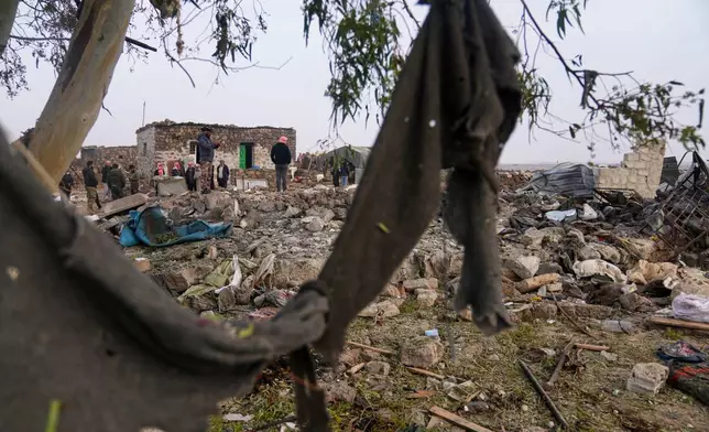 Men inspect the aftermath of a Jordanian airstrike in Al-Tuff, in the countryside of Daraa province in southern Syria, Tuesday, Oct. 27, 2026. (AP Photo/Ghaith Alsayed)