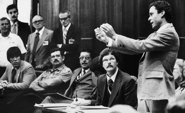 FILE - Ted Bundy presents a motion during his murder trial in Miami, June 25, 1979. (AP Photo, Pool, File)