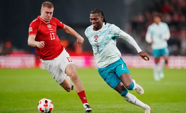 Denmark's Rasmus Nissen Kristensen, left, and Portugal's Rafael Leao in action during the Nations League soccer match between Denmark and Portugal, in Copenhagen, Thursday, Oct. 1, 2026. (Sebastian Elias Uth/Ritzau Scanpix via AP)