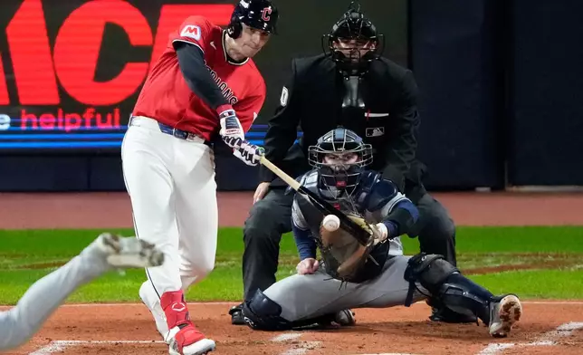 Cleveland Guardians' Chase DeLauter watches his RBI-single against the Tampa Bay Rays during the first inning in Game 4 of an American League Championship Series baseball game in Cleveland, Saturday, Oct. 17, 2026. (AP Photo/Sue Ogrocki)