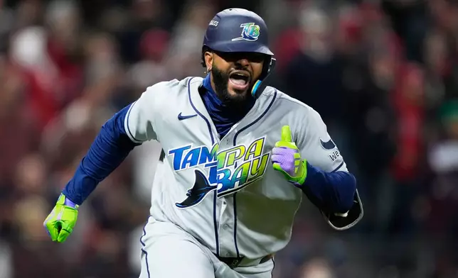 Tampa Bay Rays' Junior Caminero celebrates a RBI-double against the Cleveland Guardians during the sixth inning in Game 4 of an American League Championship Series baseball game in Cleveland, Saturday, Oct. 17, 2026. (AP Photo/David J. Phillip)
