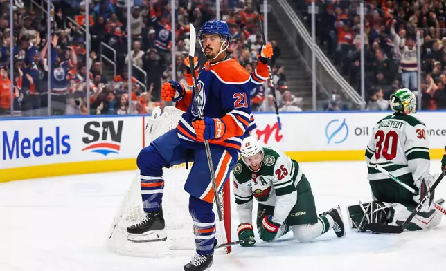 Edmonton Oilers' Mathieu Joseph (21) celebrates a goal against the Minnesota Wild during during the second period of an NHL hockey game in Edmonton, Tuesday, Oct. 20, 2026. (Codie McLachlan/The Canadian Press via AP)